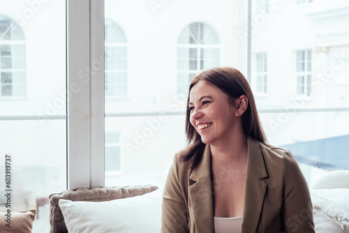 Free Download Portrait of a beautiful young smiling woman looking away. Concept of wellbeing and self-care - GFXLoad