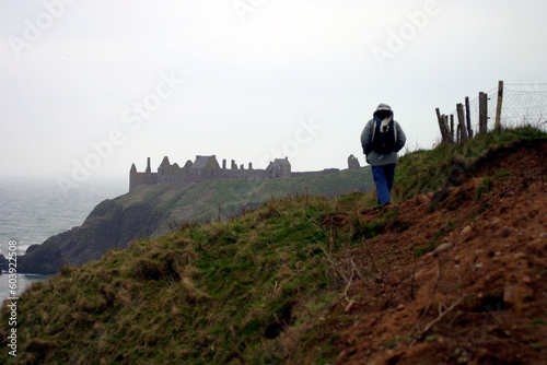 Walker towards Dunnottar Castle - Stonehaven - Aberdeenshire - Scotland - UK