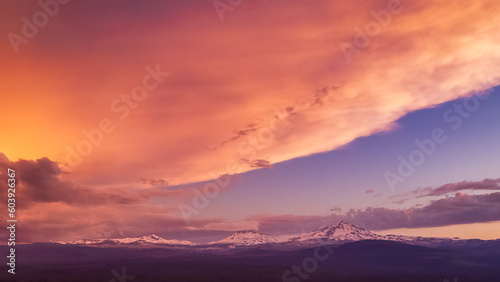 A Cascade Sun Sets over the Cascades in Central Oregon © Wasim