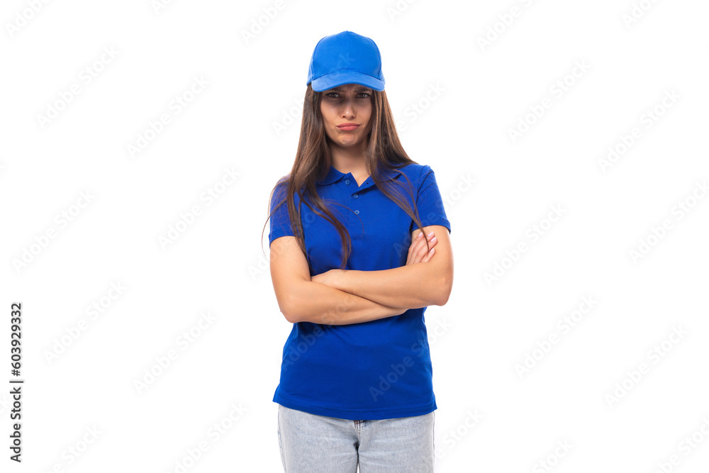 pensive pretty young brunette woman in blue cap and t-shirt with mockup for print on white background with copy space pensive pretty young brunette woman in blue cap and t-shirt with mockup for print on white background with copy space