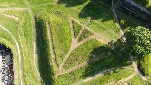 Rocket spiral drone of a geometric shape drawn by the passage of the inhabitants on the grass photo