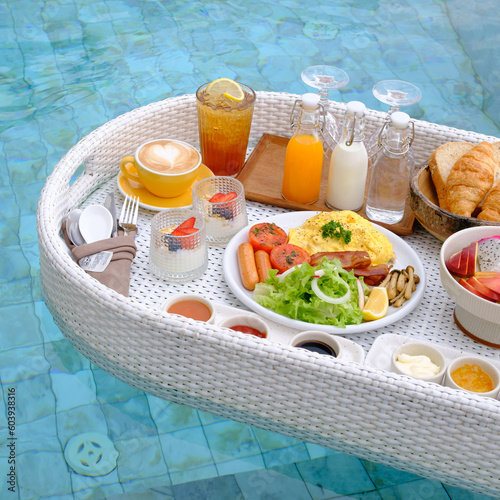 Breakfast in swimming pool, floating breakfast in tropical resort