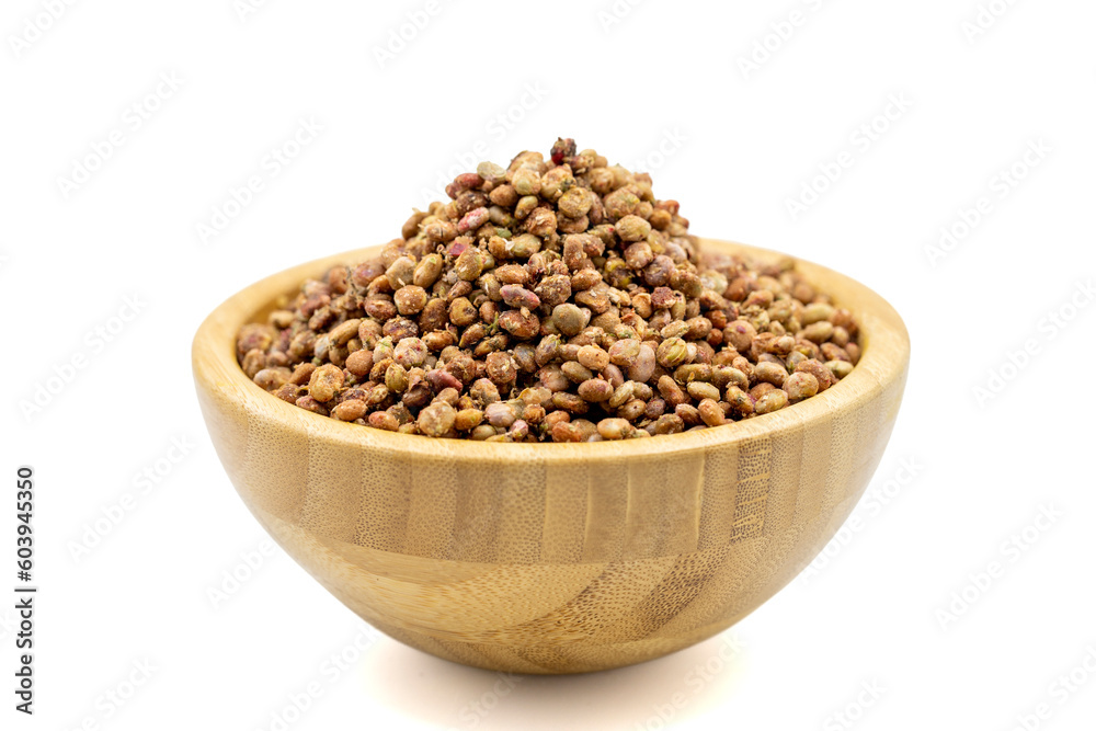 Sumac seeds. Dried sumac berries isolated on white background. Spice concept