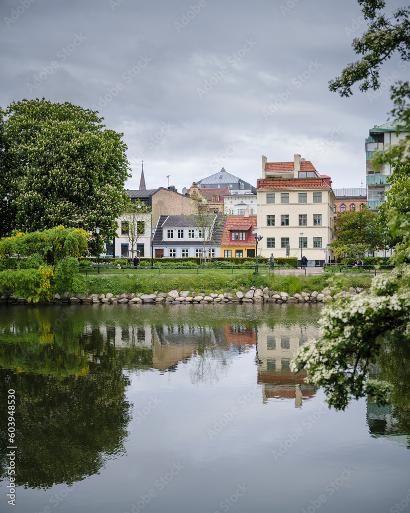 Buildings, trees, and canal in Malmo, Sweden Buildings, trees, and canal in Malmo, Sweden