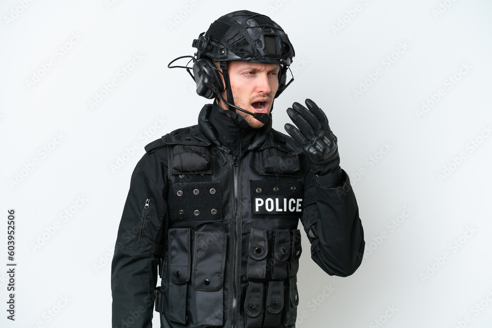 SWAT man over isolated white background yawning and covering wide open mouth with hand SWAT man over isolated white background yawning and covering wide open mouth with hand