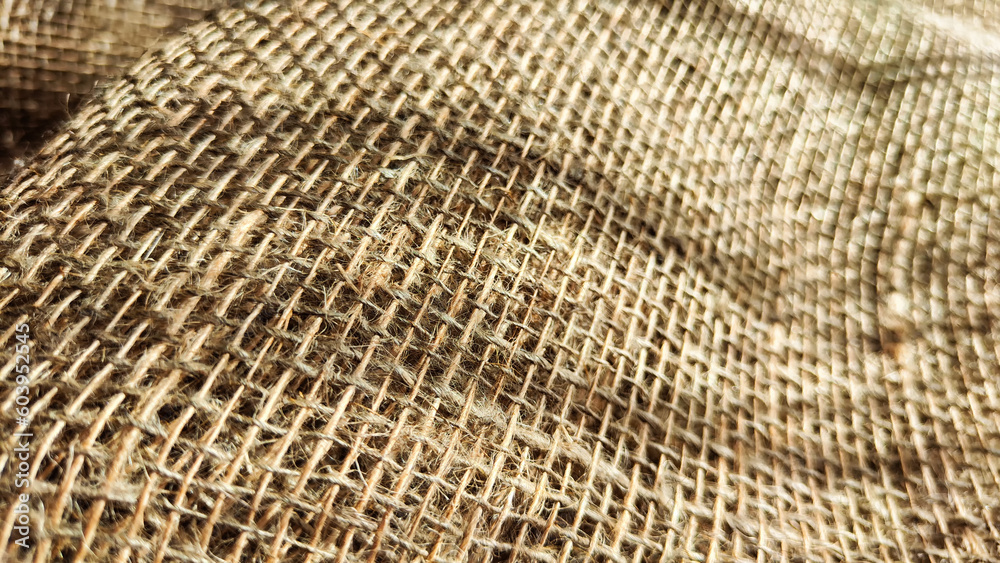 Natural fabric texture, frame and background of burlap. Rough crumpled burlap background. Selective and partial focus Natural fabric texture, frame and background of burlap. Rough crumpled burlap background. Selective and partial focus