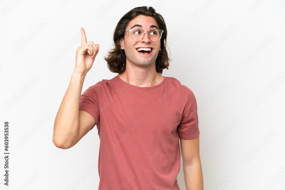 Young handsome man isolated on white background intending to realizes the solution while lifting a finger up Young handsome man isolated on white background intending to realizes the solution while lifting a finger up