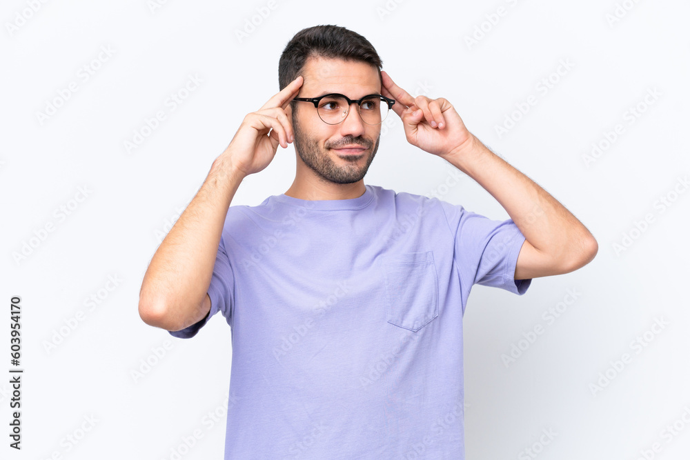 Young caucasian man isolated on white background having doubts and thinking Young caucasian man isolated on white background having doubts and thinking