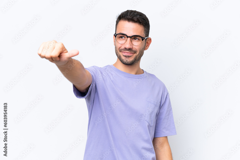 Young caucasian man isolated on white background giving a thumbs up gesture Young caucasian man isolated on white background giving a thumbs up gesture