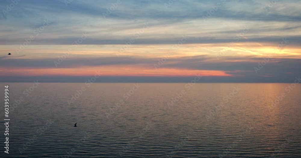Complete calm on the Adriatic Sea, beautiful evening sky and seagulls. Complete calm on the Adriatic Sea, beautiful evening sky and seagulls.