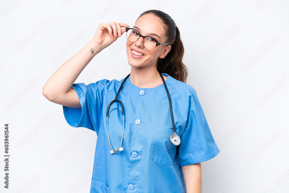 Young caucasian surgeon doctor woman isolated on white background with glasses and happy Young caucasian surgeon doctor woman isolated on white background with glasses and happy