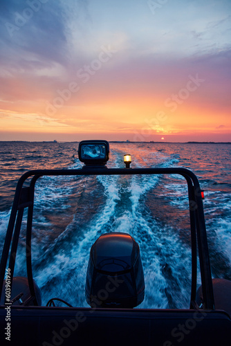 Motor of boat on sea at sunset