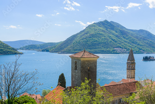 The bell tower of St Nicholas church in Perast and Verige is the strait of Boka Kotorska in the background. Montenegro photo