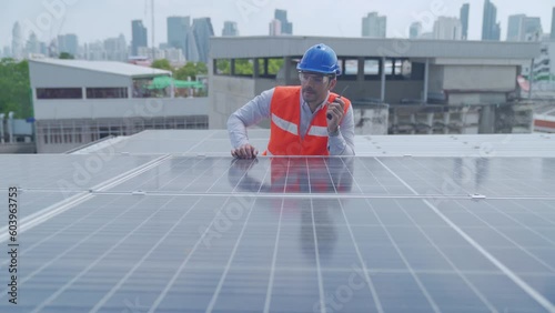Wallpaper Mural Male engineers using radio in the area of the solar panel. Foreman and Worker maintaining solar energy panel. Man using radio. Torontodigital.ca