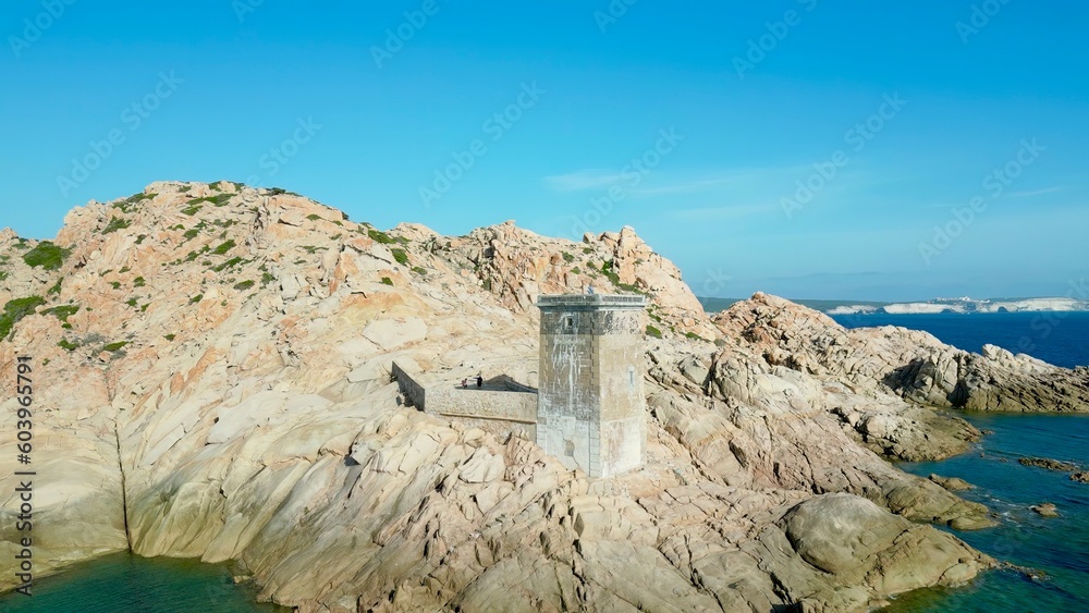 A Bird's Eye Perspective: Commanding Lighthouse of Capu di Fenu Overlooking the Rugged Coastline and Crystal-Clear Waters of Bonifacio, Corsica