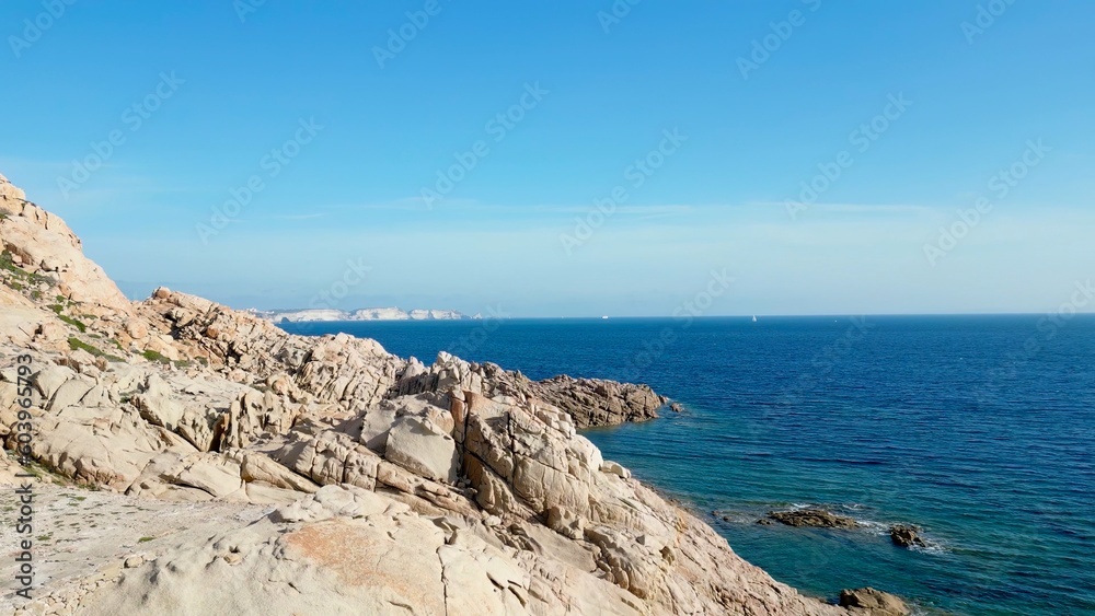 Nature's Harmony: An Aerial View of Rocky Cliffs, Endless Seascape and a Solitary Boat off the Shores of Capu di Fenu, Bonifacio, Corsica
