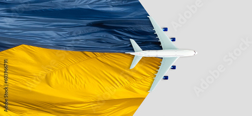 Bild auf Leinwand Toy airplane placed on the road painted the colors of the national flag of Ukrai