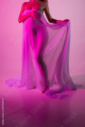 Pregnant woman in a pink dress