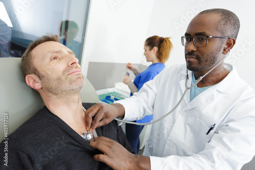 doctor with stethoscope and patient