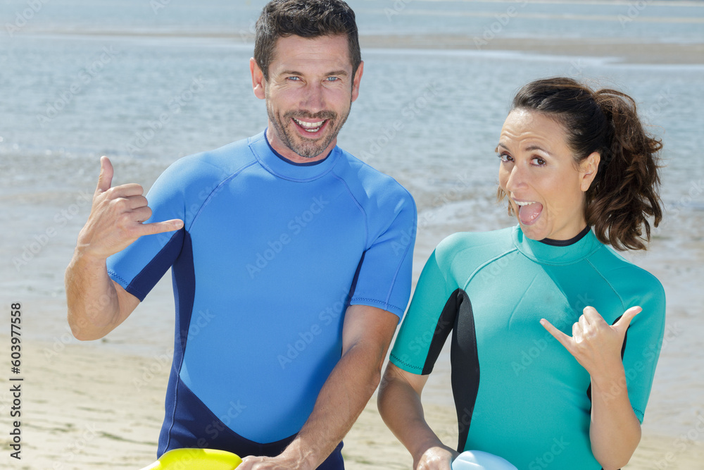 couple of bodyboard surfers ready to start couple of bodyboard surfers ready to start