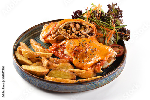 Enchilada with meat, apple slice potatoes and some green salad