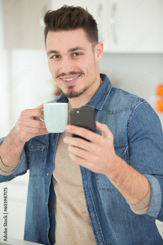 young man with a coffee happy expression young man with a coffee happy expression