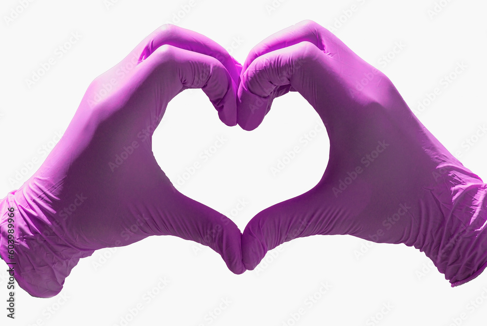 Hands in medical gloves depict a heart on a white background, isolated. Volunteer work concept Hands in medical gloves depict a heart on a white background, isolated. Volunteer work concept