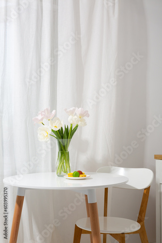 Spring bouquet tulips on white table indoor