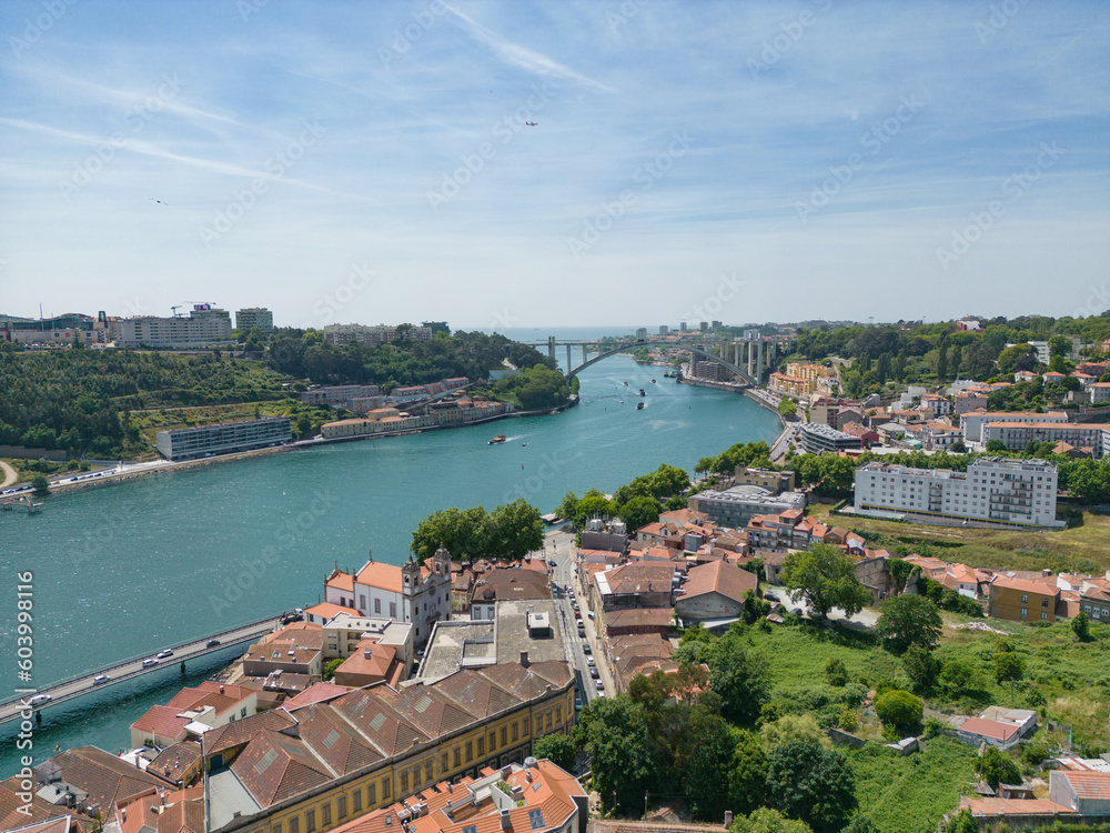 Aerial view of the Douro River in Porto. Aerial drone view of the city of Porto in Lisbon, the image includes bridges, riverside and the typical houses of the city, fado