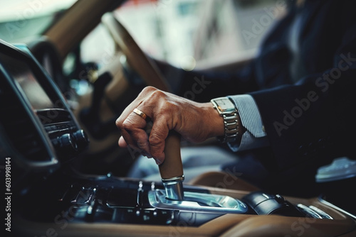 Driving, car and gear with hand of man for manual, transportation and engine. Luxury, test drive and safety with closeup of male driver in vehicle for commute, travel and automobile transmission