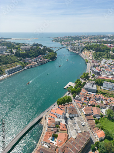 Aerial view of the Douro River in Porto. Aerial drone view of the city of Porto in Lisbon, the image includes bridges, riverside and the typical houses of the city, fado