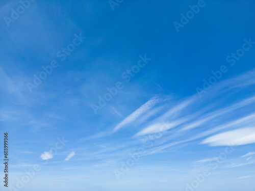 blue sky with scattered clouds, Captivating Cloudscape: Serene beauty of heavenly clouds. Perfect for web design, blog posts, presentations. High-quality, awe-inspiring. 