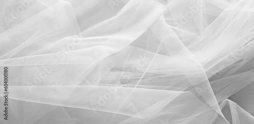 Fototapeta Beautiful white tulle fabric as background, banner design