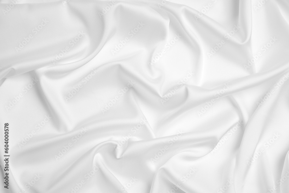 Obraz premium White silk fabric as background, top view
