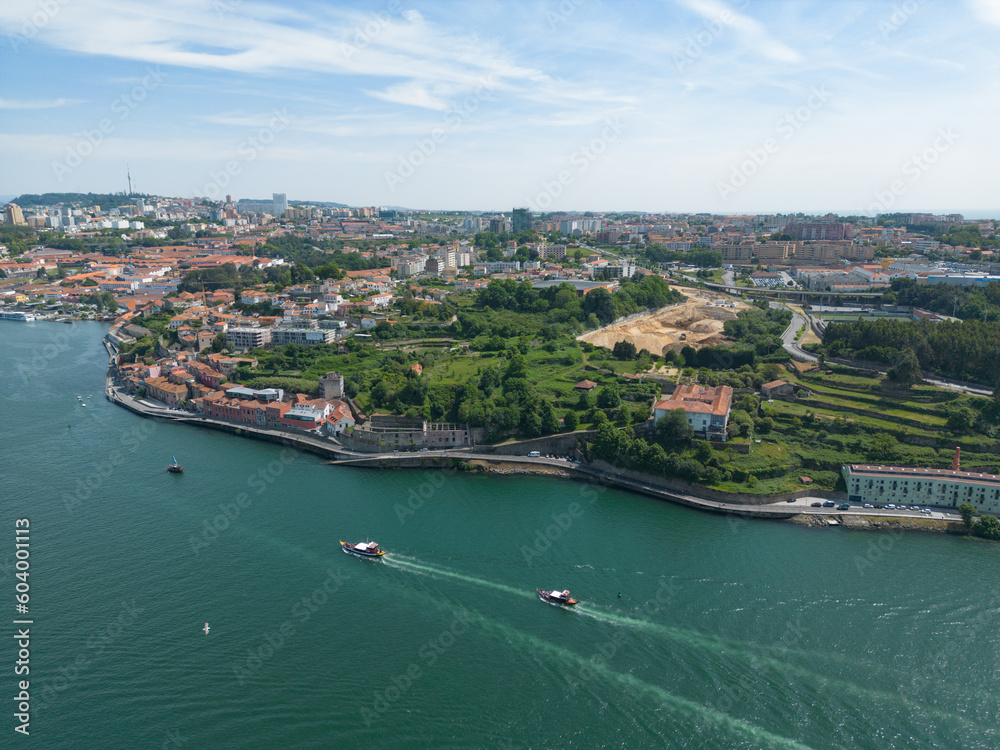 Aerial view of the Douro River in Porto. Aerial drone view of the city of Porto in Lisbon, the image includes bridges, riverside and the typical houses of the city, fado gaia