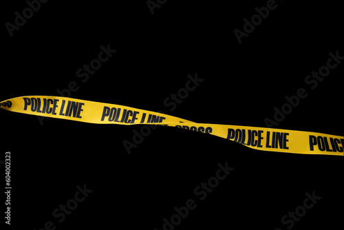 Do not cross police line tape yellow isolated on black background. This has clipping path.