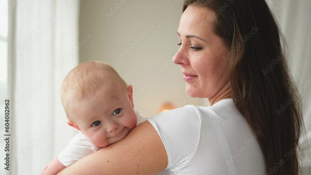 Happy family at home. Mother holding little toddler child daughter. Mom and baby girl relax playing having fun together at home. Mother hugs baby with love care. Mom of breast feeding baby Happy family at home. Mother holding little toddler child daughter. Mom and baby girl relax playing having fun together at home. Mother hugs baby with love care. Mom of breast feeding baby