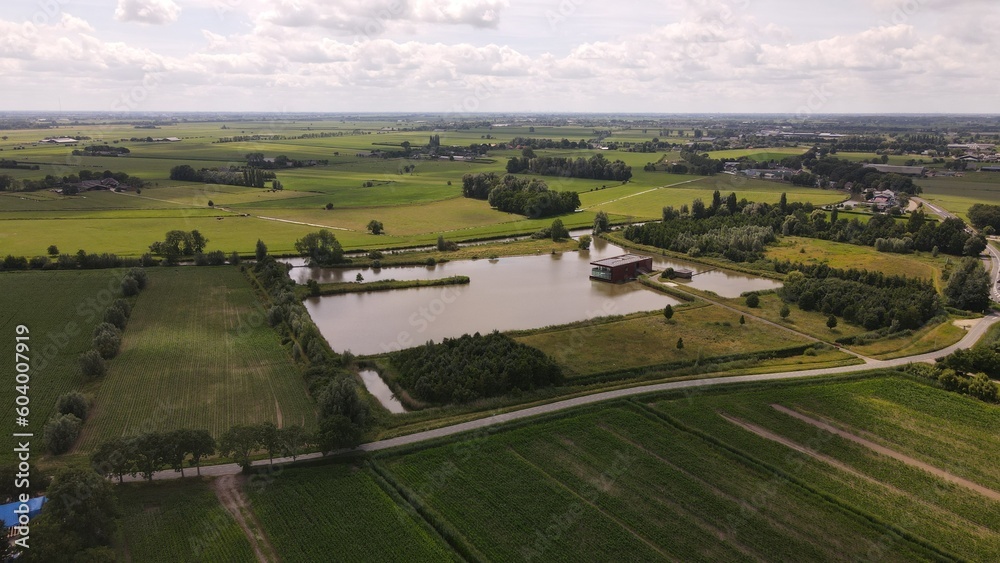 Drone photo of lake house in dutch landscape