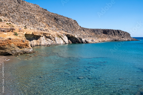 View of rocky coastline of Kato Zakros, transparent seabed with pebbles. Lasithi Province, Crete Greece 