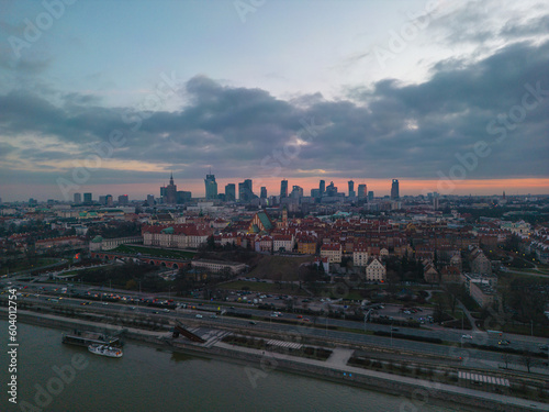 Beautiful panoramic aerial drone skyline sunset view of the Warsaw City Centre with skyscrapers of the Warsaw City and Warsaw s old town with a market square and a mermaid statue  Poland  EU