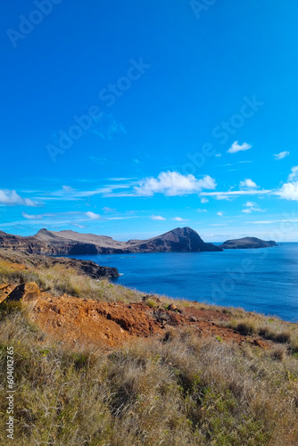 The rocky coast of the island of Madeira in the ocean. Beautiful tourist island. © Dzmitry