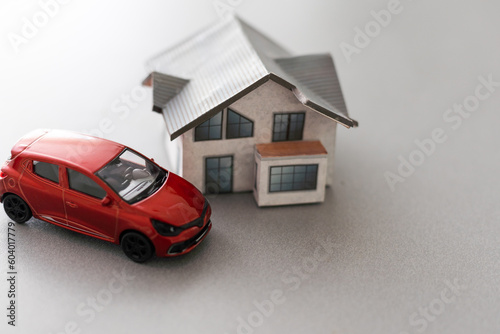 Home and car artificial on the concrete.