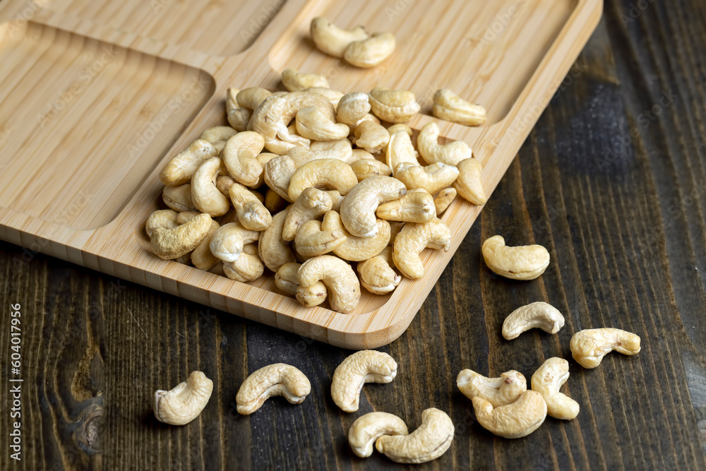 Hard roasted and peeled cashew nuts on the table Hard roasted and peeled cashew nuts on the table