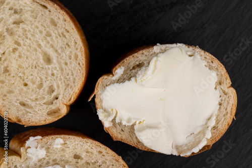 fresh soft cheese made from cow's milk spread on wheat bread