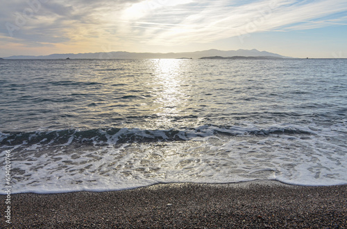 Fototapeta Naklejka Na Ścianę i Meble -  scenic view of Pasas, Inousses and Chios Greek Islands in Aegean sea from Tuzla beach (Karaburun, Izmir province, Turkiye)
