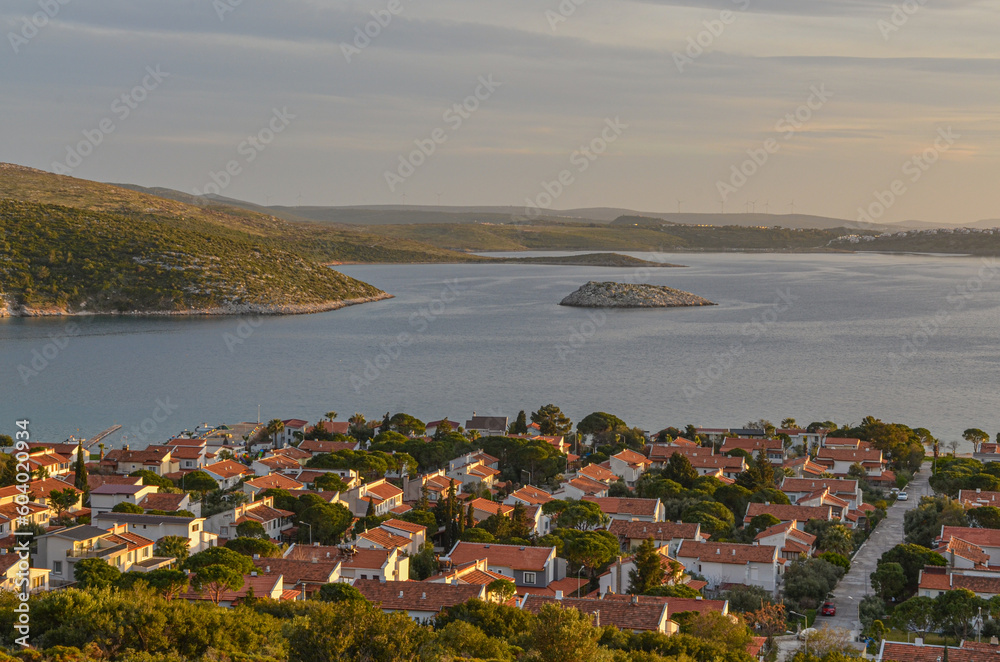 scenic view of Gerence Bay, Gerence Ada island and Iltur Sitesi town on Turkish Aegean coast  at sunset (Balikliova, Izmir province, Turkiye)