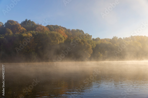Fog-covered river in the autumn season