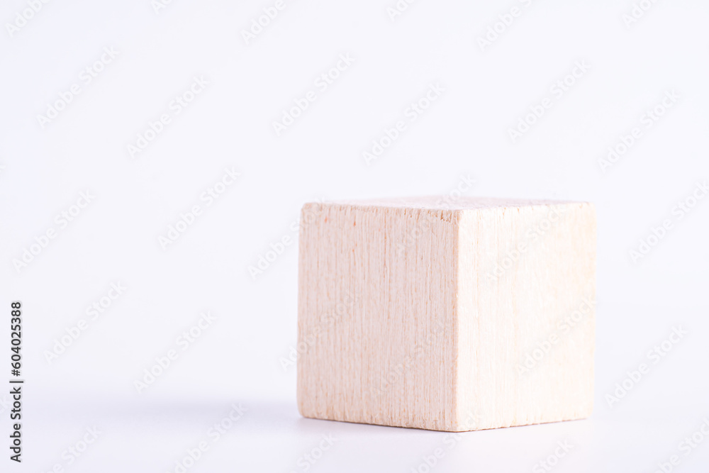 Wooden cube of natural color on white background. One blank box, macro photo. Wooden cube of natural color on white background. One blank box, macro photo.