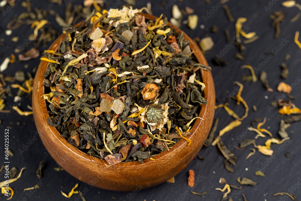 Fototapeta premium fresh green tea with pieces of fruit and berries