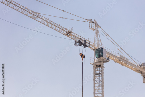 Construction crane at sky bavkground. © tarasov_vl
